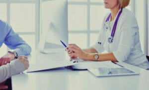 doctor sitting with patient